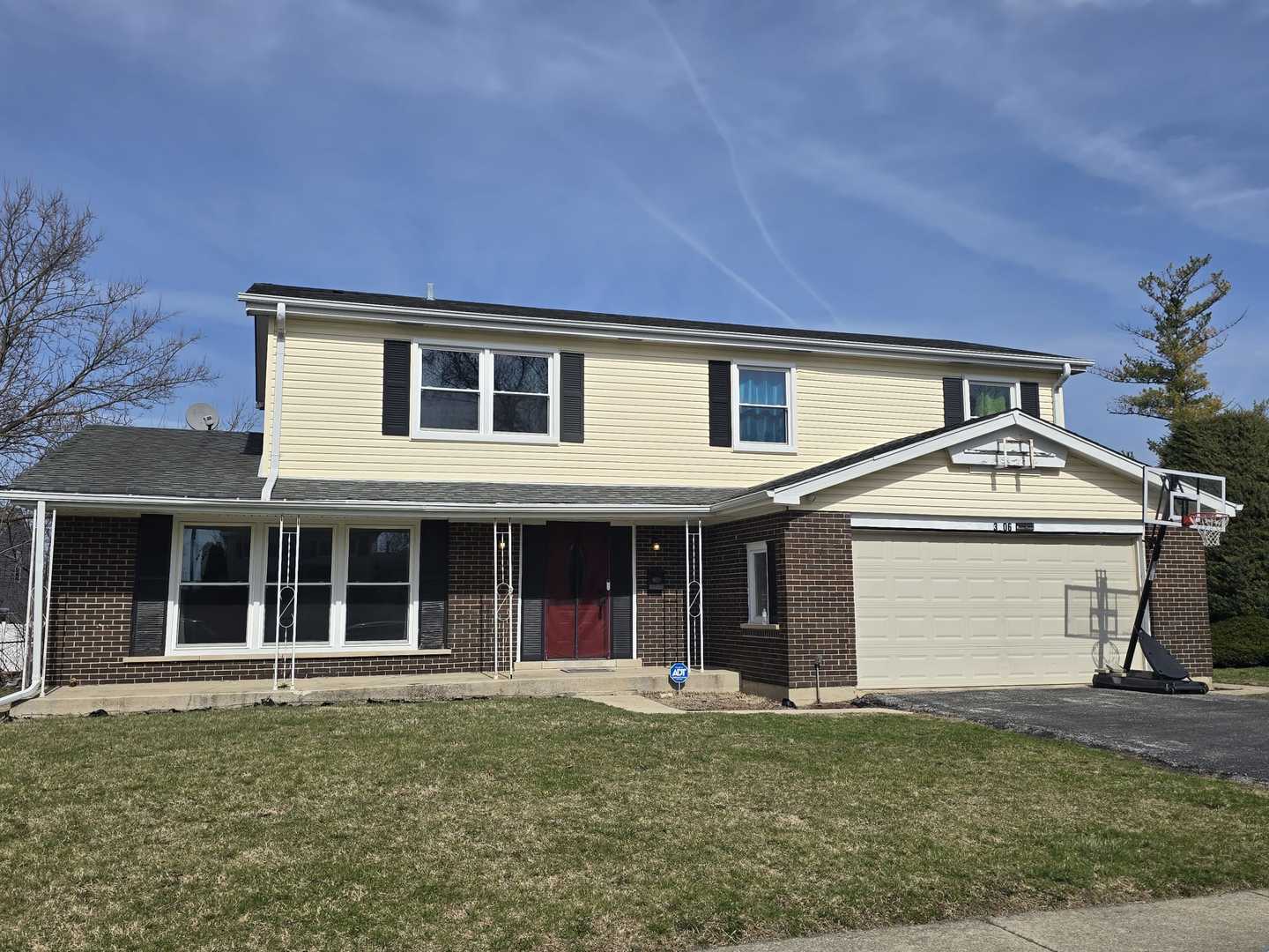 3006 Buttonwood Walk Hazel Crest, IL 60429 - Photo 1 of 18 a front view of a house with a garden