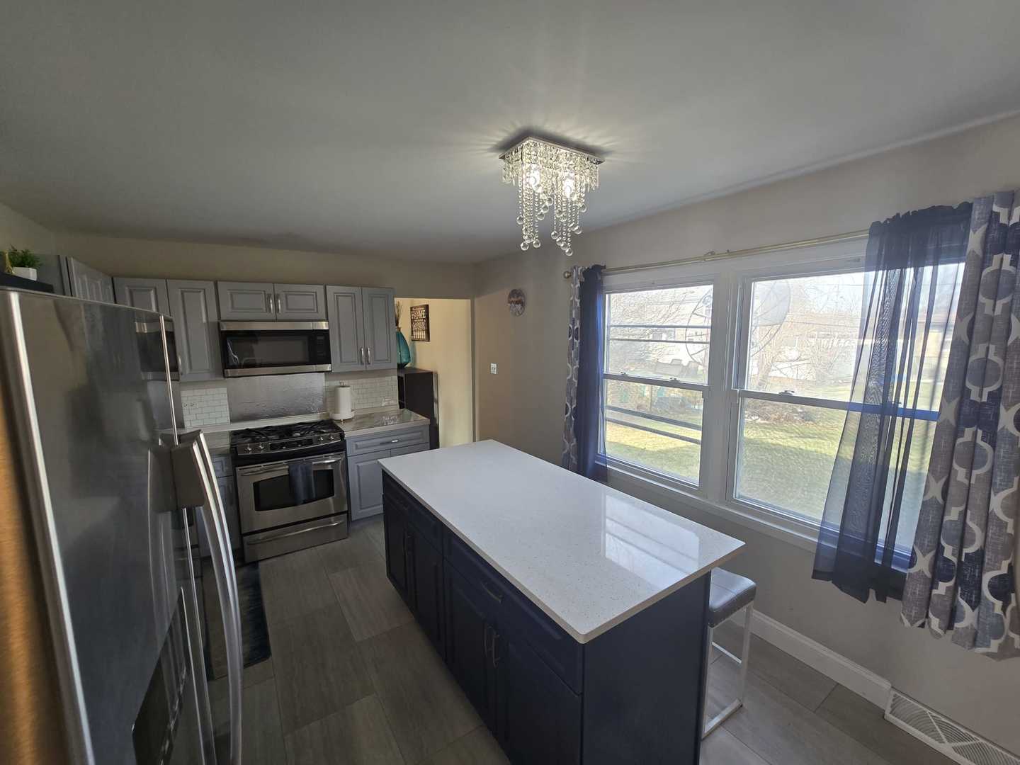 3006 Buttonwood Walk Hazel Crest, IL 60429 - Photo 11 of 18 a kitchen with refrigerator cabinets and wooden floor
