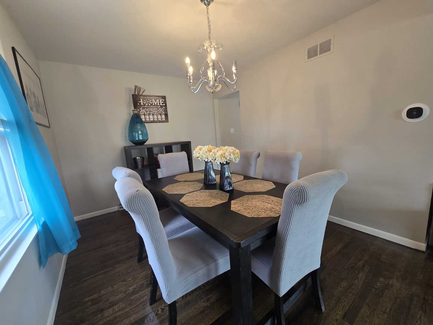 3006 Buttonwood Walk Hazel Crest, IL 60429 - Photo 8 of 18 a view of a dining room with furniture a chandelier and wooden floor
