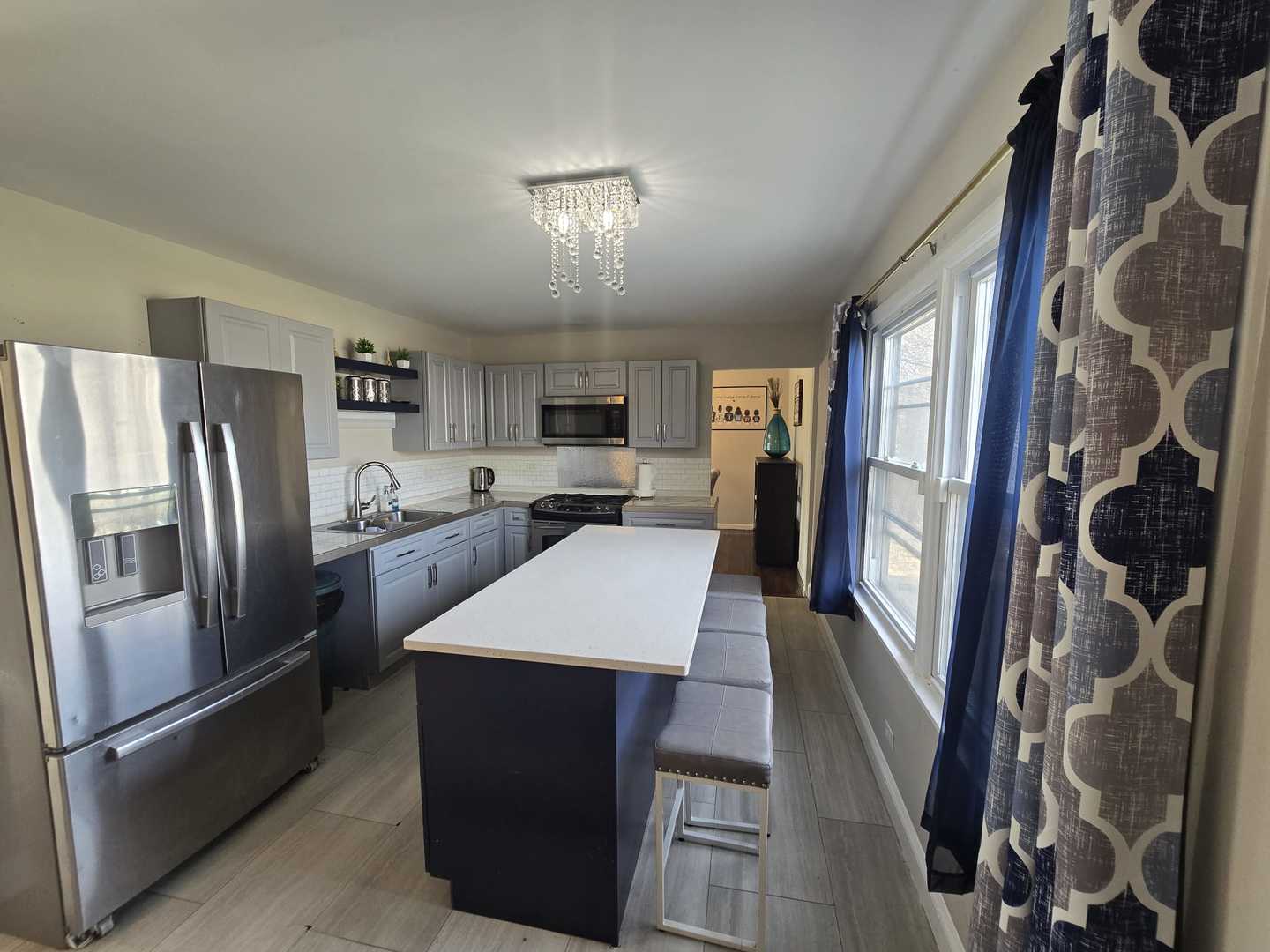 3006 Buttonwood Walk Hazel Crest, IL 60429 - Photo 10 of 18 a large kitchen with a refrigerator a sink and cabinets