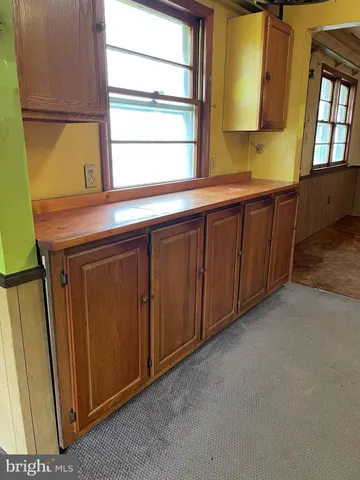 a kitchen with a sink and a window
