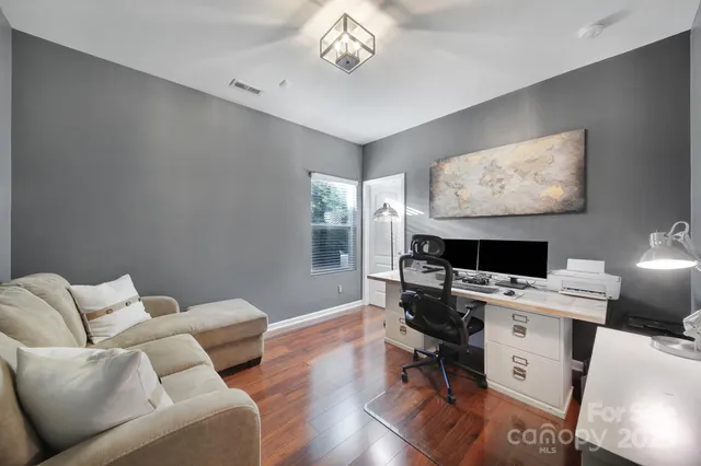 a workspace with furniture and a window