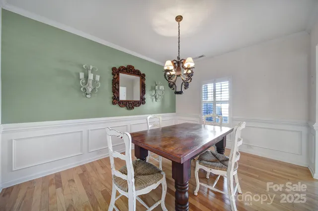 a view of a dining room with furniture and window