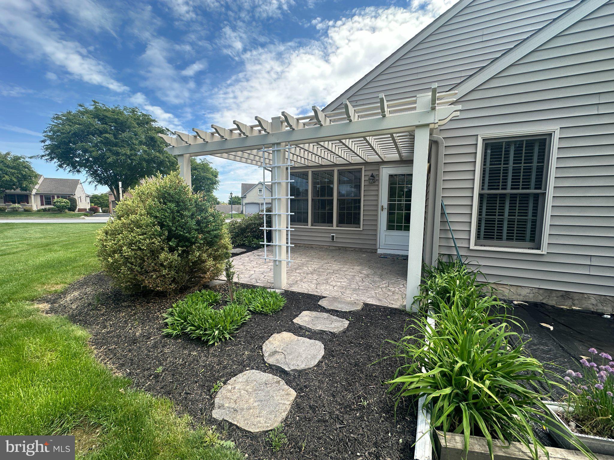 749 Heather Ridge Manheim, PA 17545 - Photo 30 of 36 Charming patio with lush greenery.