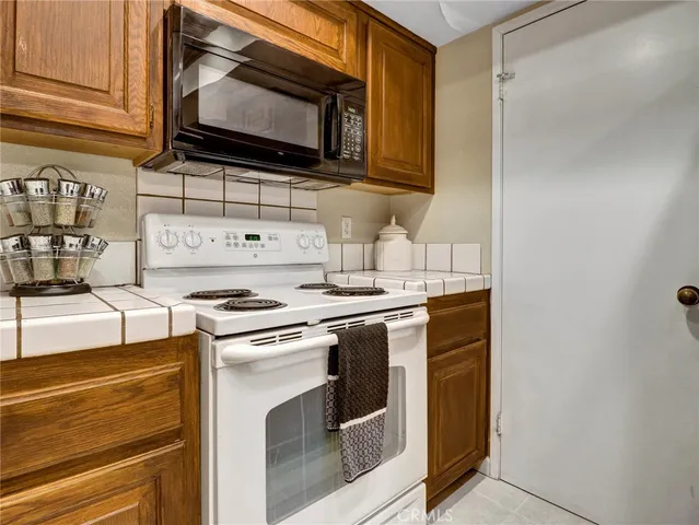 a kitchen with a stove and a microwave