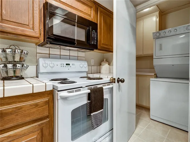 a kitchen with a stove microwave and refrigerator
