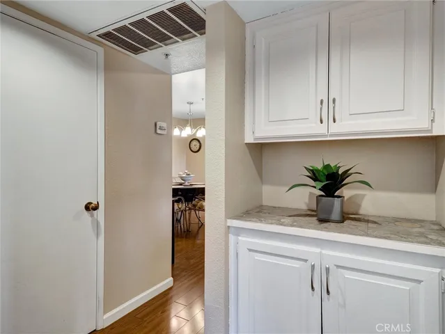 a kitchen with a refrigerator and cabinets