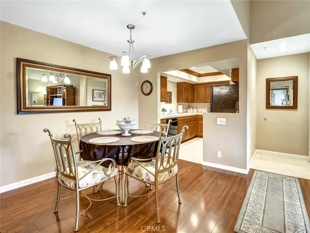 a view of a dining room with furniture and chandelier