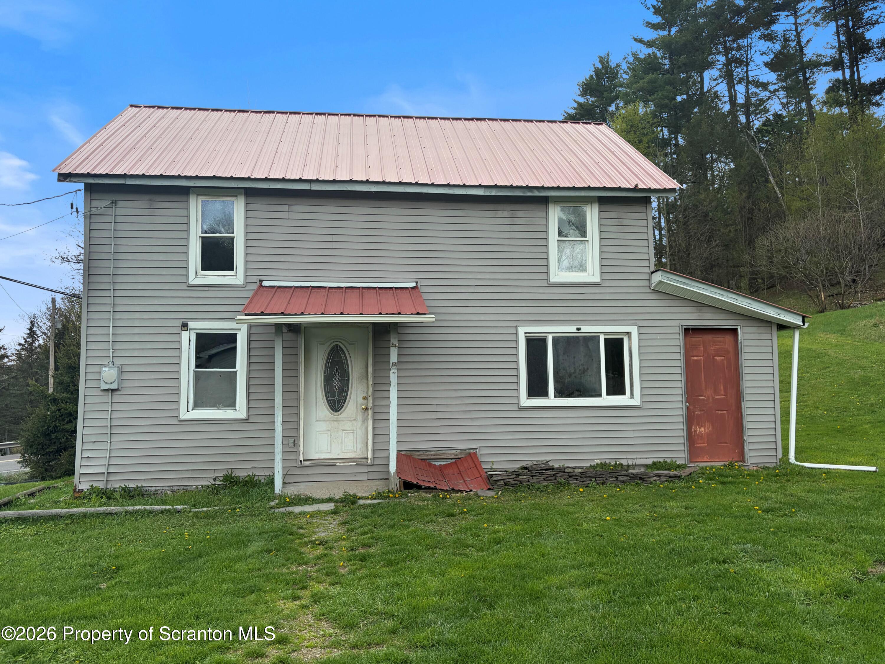 2466 State Rte 4002 Mehoopany, PA 18629 - Photo 1 of 11 a front view of a house with a yard
