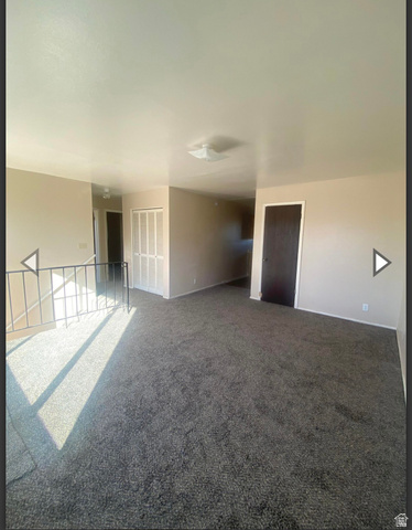 102 East Richelman Lane Wellington, UT 84542 - Photo 20 of 39 Empty room featuring carpet and baseboards