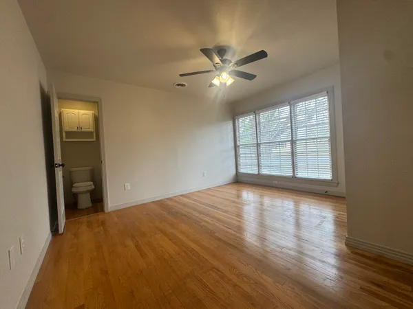 a bathroom with a sink vanity granite and a mirror