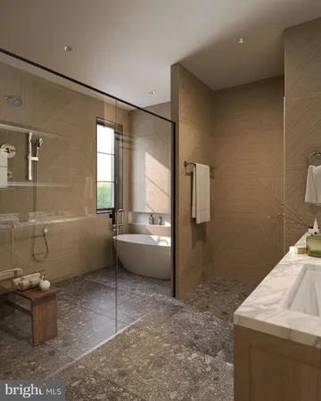 a bathroom with a tub sink and mirror