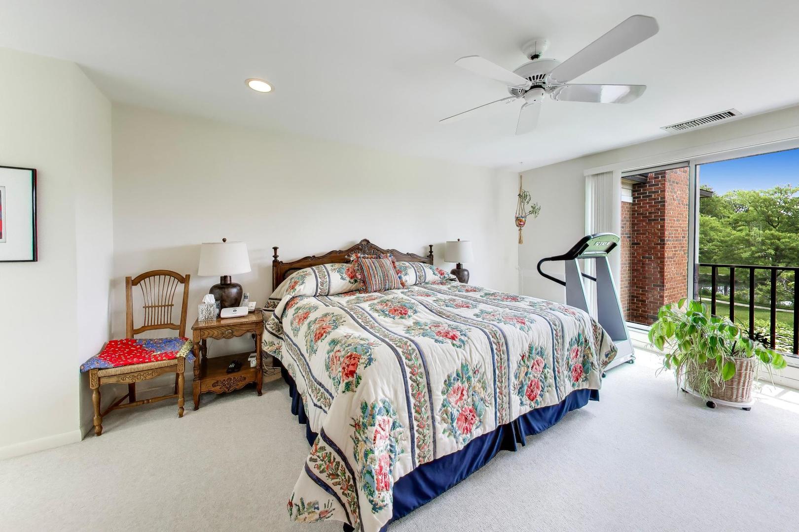 495 Milford Road Deerfield, IL 60015 - Photo 13 of 33 a bedroom with a bed and a chandelier