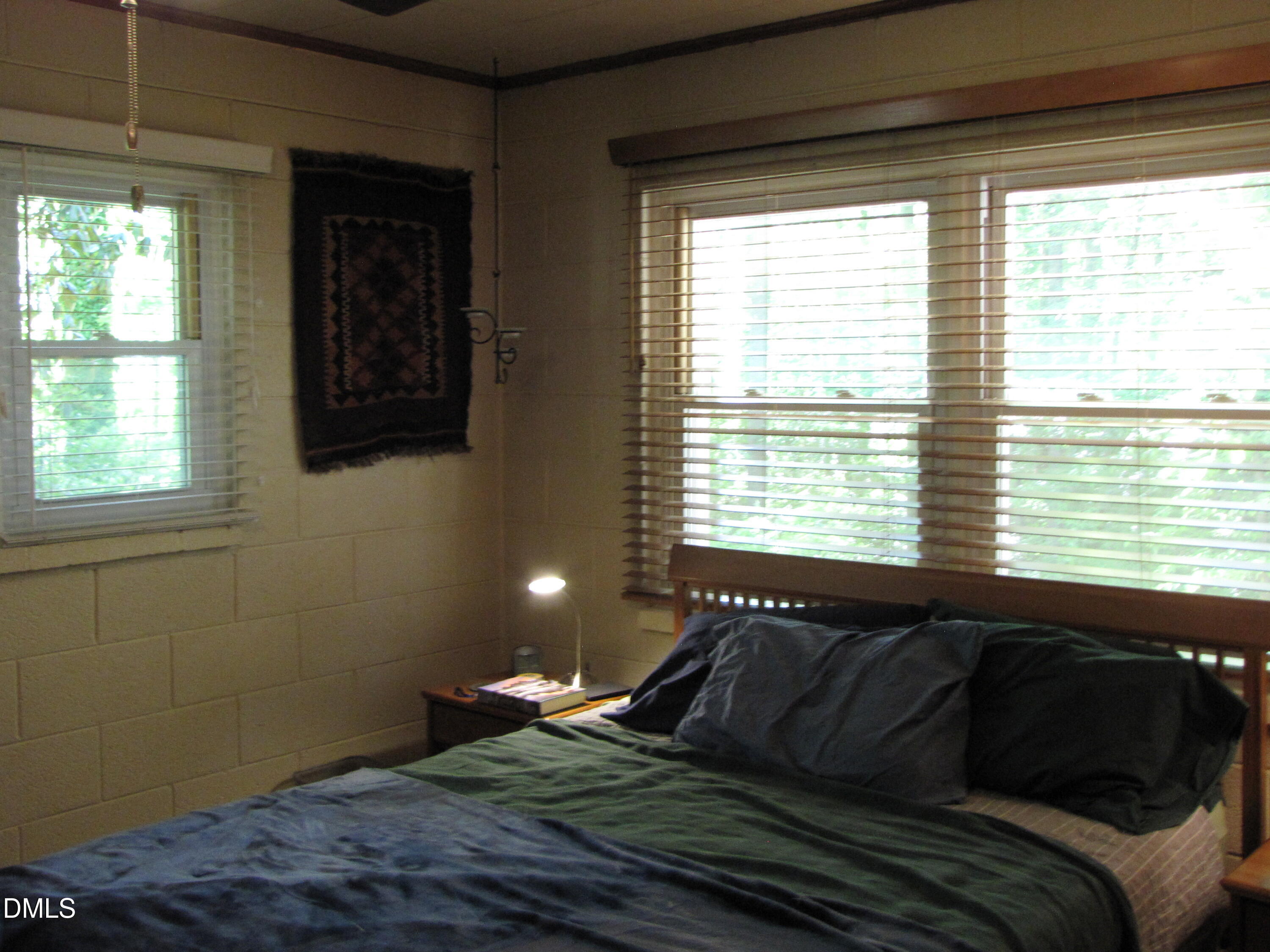 2907 Elgin Street Durham, NC 27704 - Photo 12 of 19 a bedroom with a bed and a window