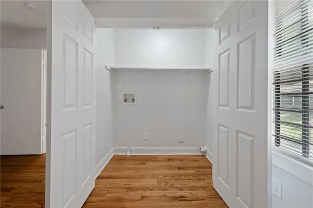 a view of a room with wooden floor and staircase