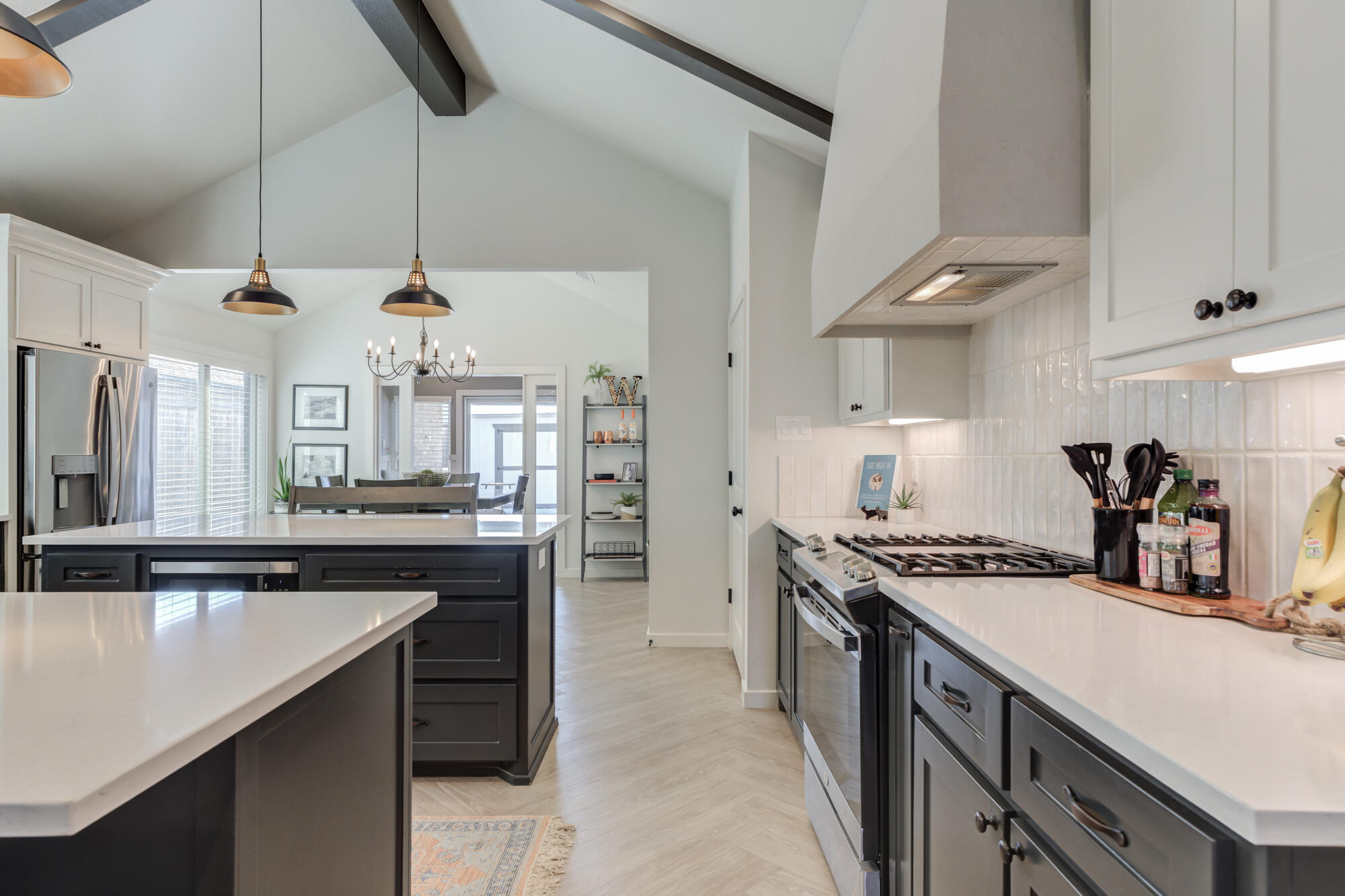 3627 128th Street Lubbock, TX 79423 - Photo 15 of 60 a kitchen with stainless steel appliances granite countertop a sink a stove and a refrigerator