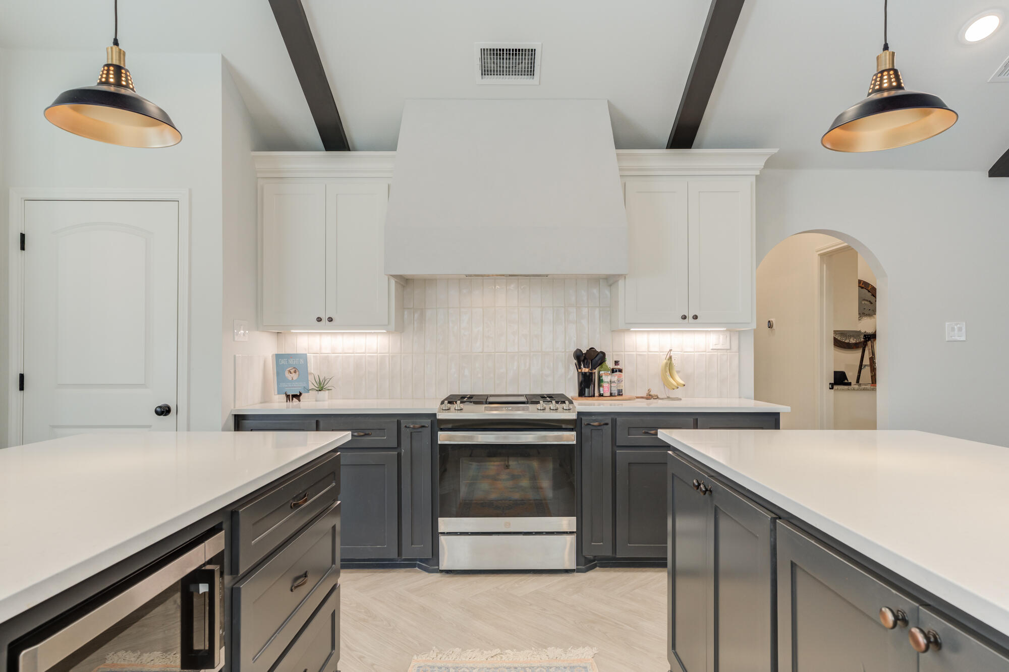 3627 128th Street Lubbock, TX 79423 - Photo 20 of 60 a kitchen with a sink a stove and cabinets
