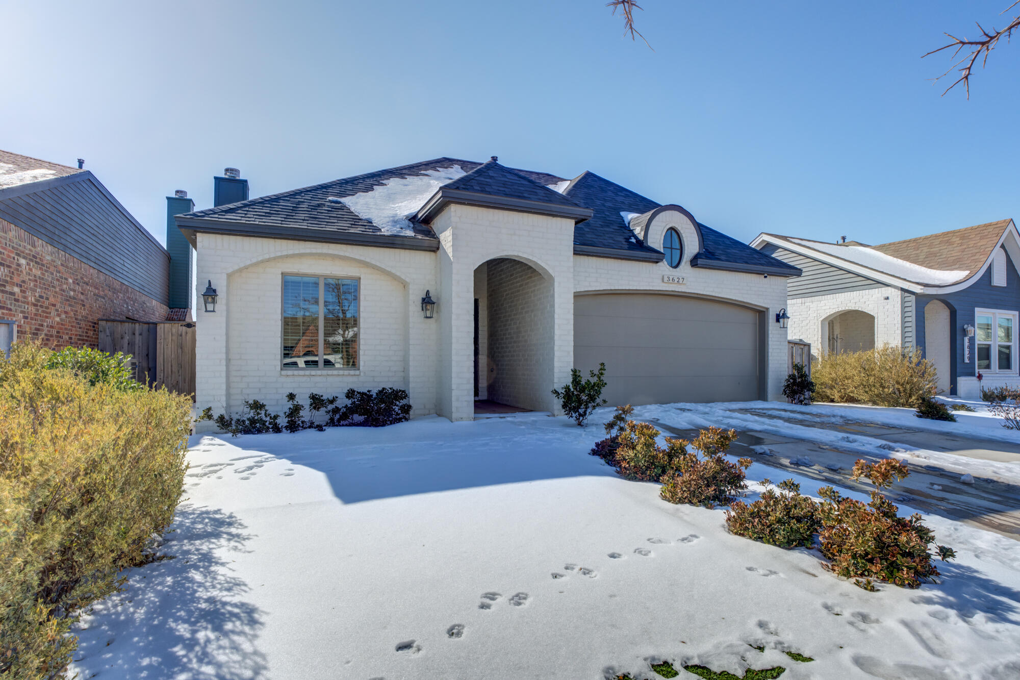 3627 128th Street Lubbock, TX 79423 - Photo 2 of 60 a front view of a house with a yard
