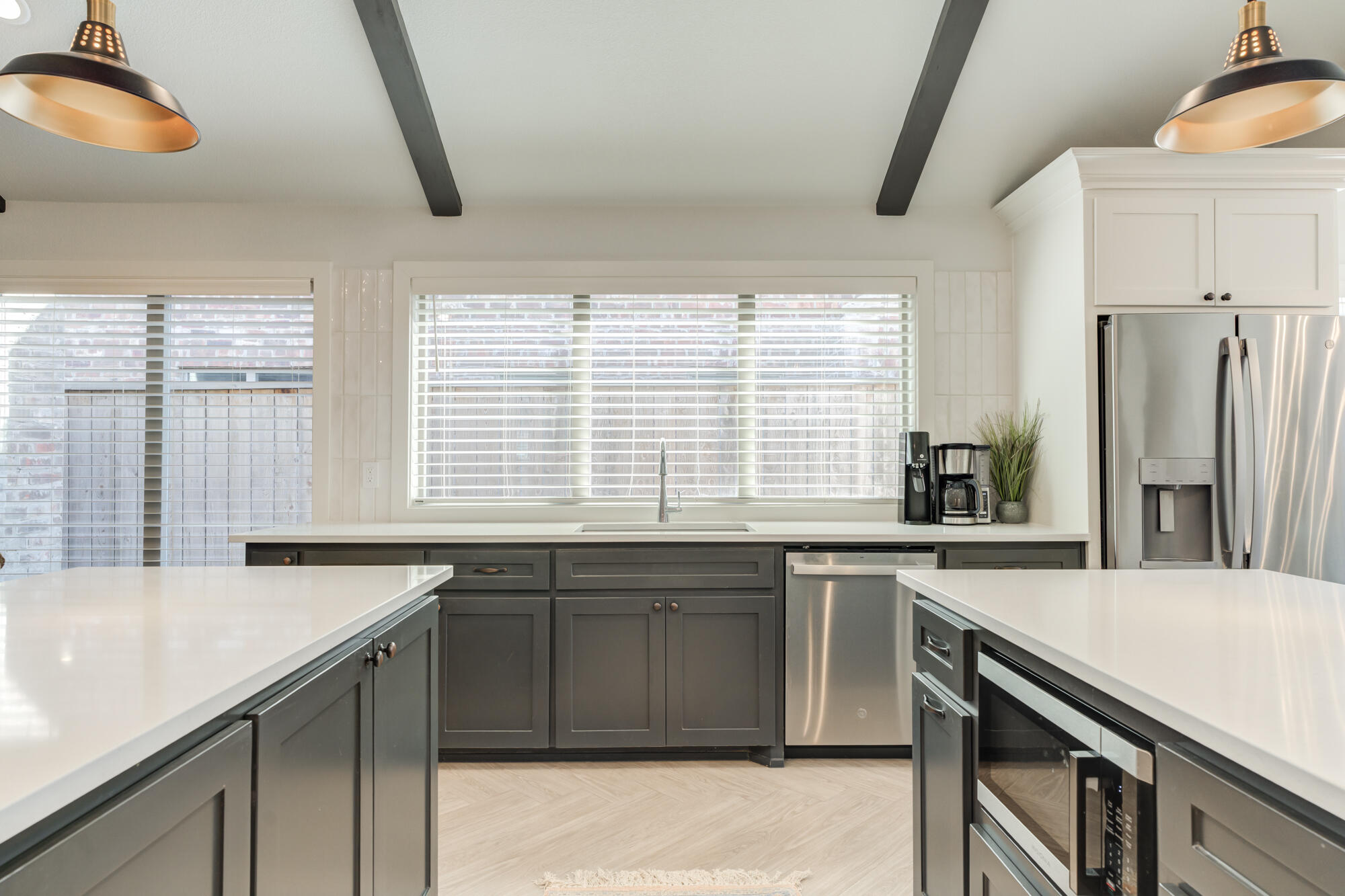3627 128th Street Lubbock, TX 79423 - Photo 21 of 60 a kitchen with stainless steel appliances granite countertop a sink and a stove