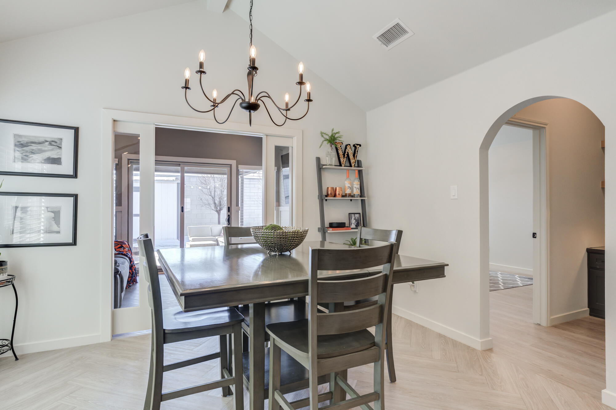 3627 128th Street Lubbock, TX 79423 - Photo 26 of 60 a view of a dining room with furniture and wooden floor