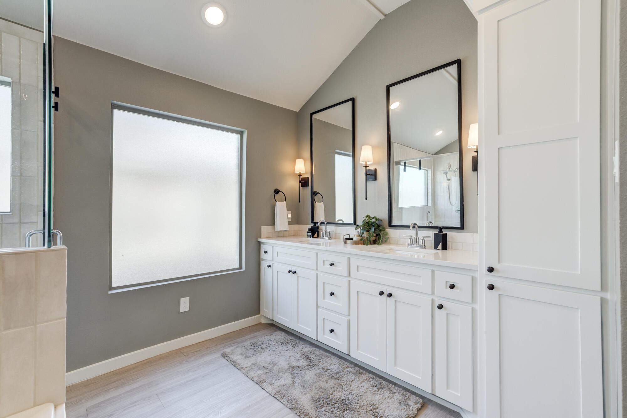 3627 128th Street Lubbock, TX 79423 - Photo 32 of 60 a spacious bathroom with a mirror a sink and a mirror