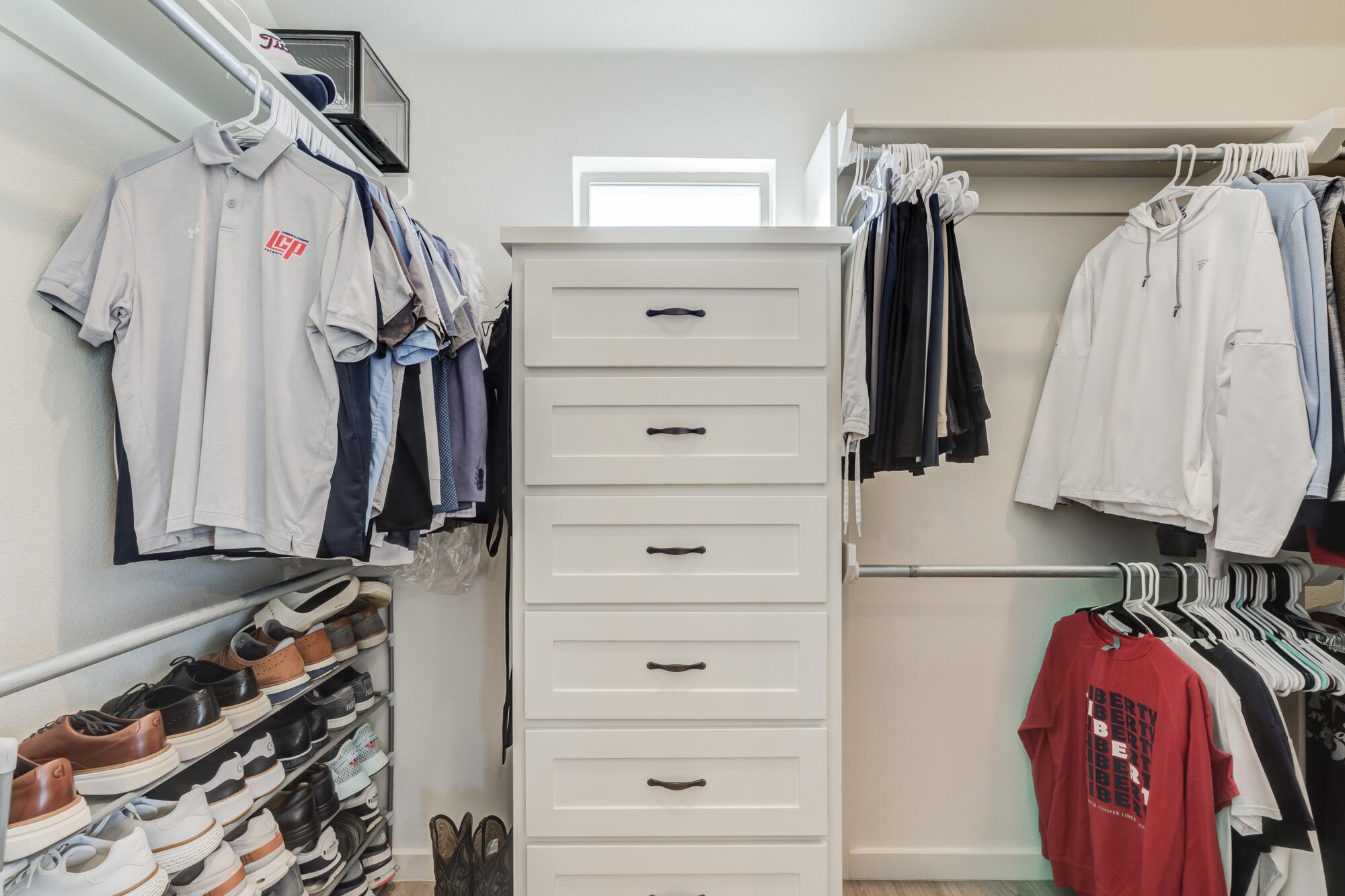 3627 128th Street Lubbock, TX 79423 - Photo 36 of 60 a view of walk in closet with clothes and shoes