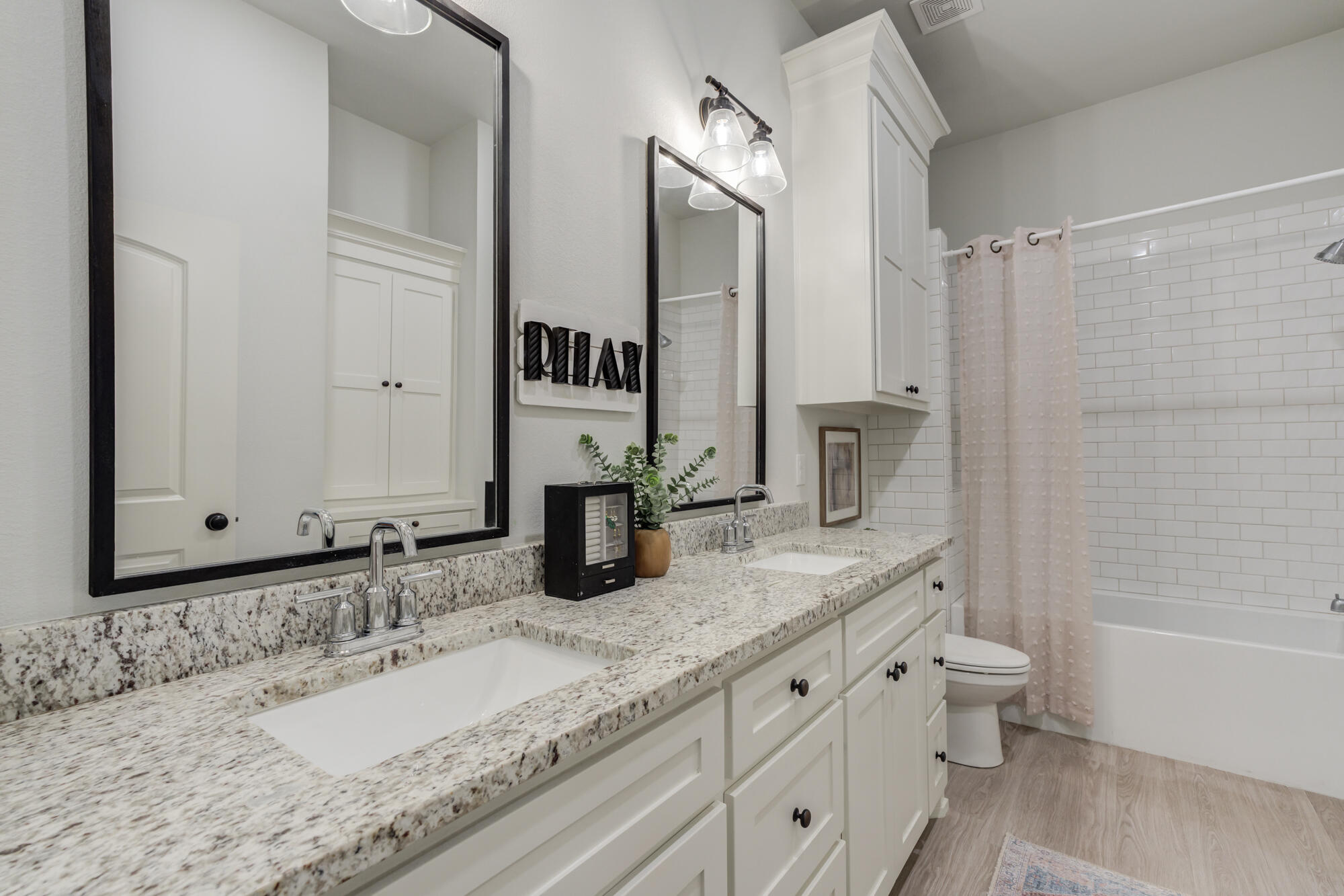 3627 128th Street Lubbock, TX 79423 - Photo 40 of 60 a bathroom with a granite countertop sink and a mirror