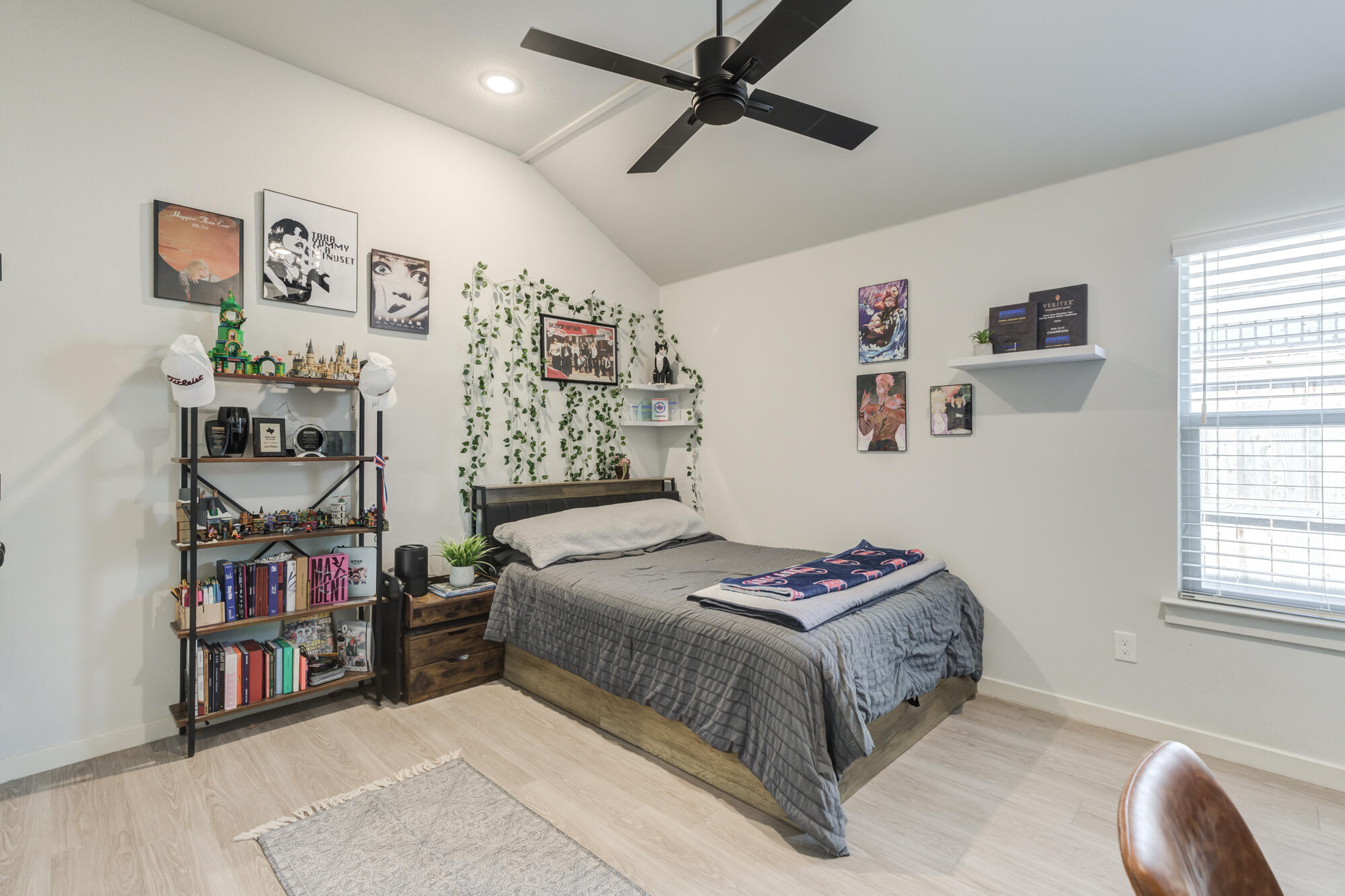 3627 128th Street Lubbock, TX 79423 - Photo 42 of 60 a bedroom with a bed and a book shelf