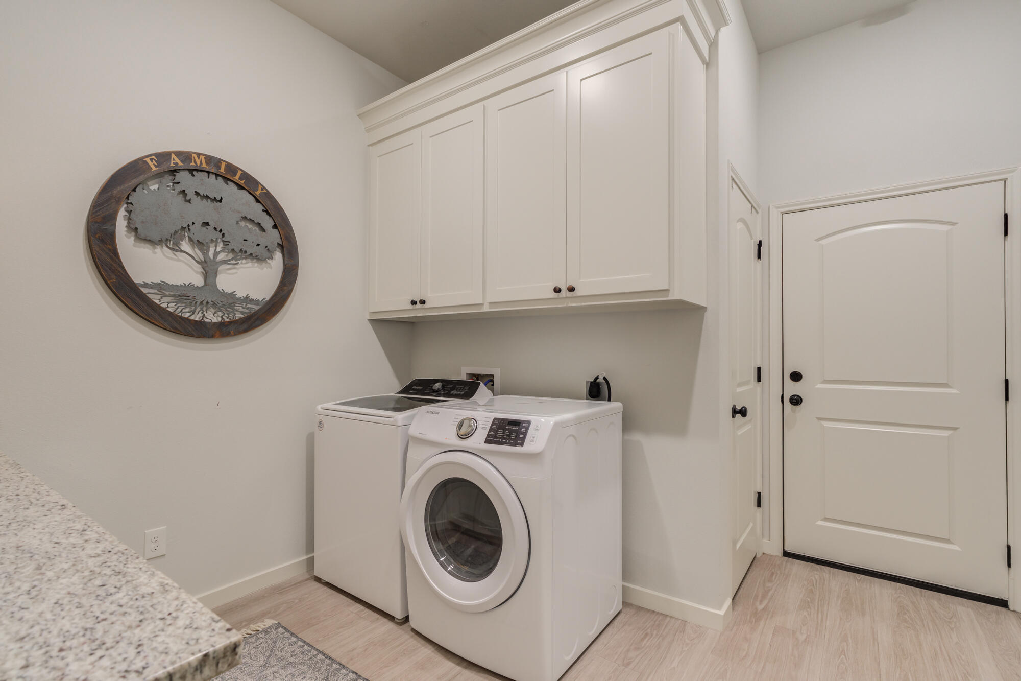 3627 128th Street Lubbock, TX 79423 - Photo 47 of 60 a view of a storage and utility room with a washer and dryer