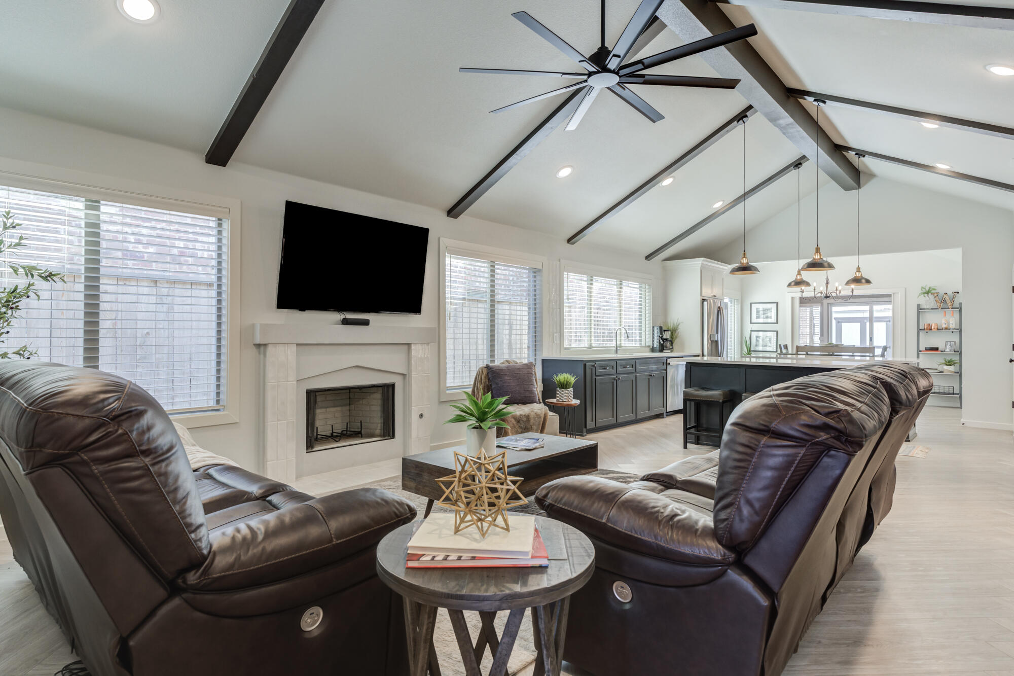 3627 128th Street Lubbock, TX 79423 - Photo 5 of 60 a living room with furniture a fireplace and a flat screen tv