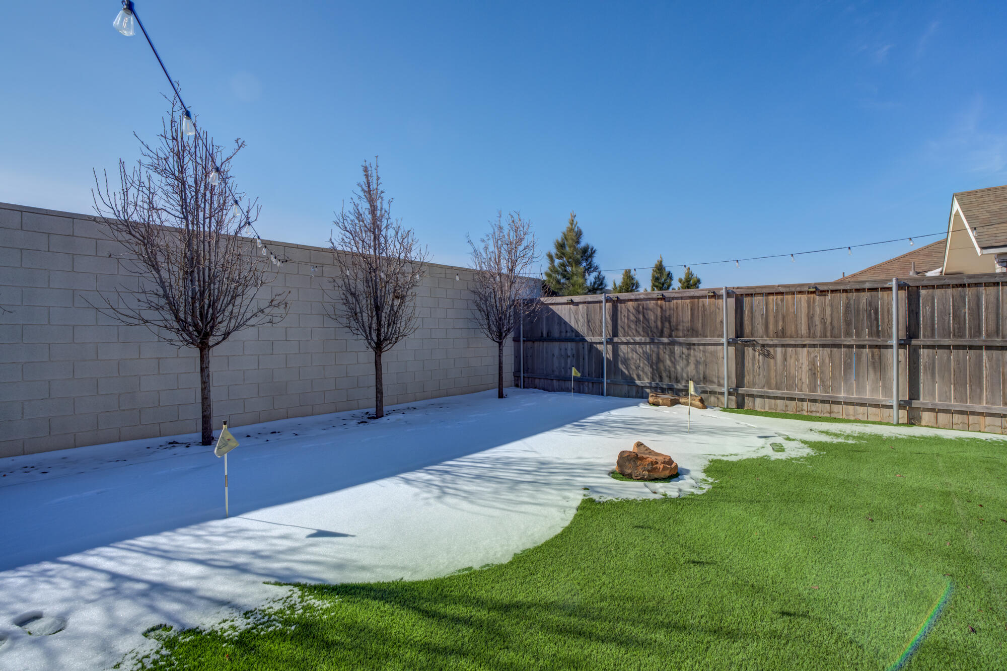 3627 128th Street Lubbock, TX 79423 - Photo 57 of 60 a backyard of a house with table and chairs