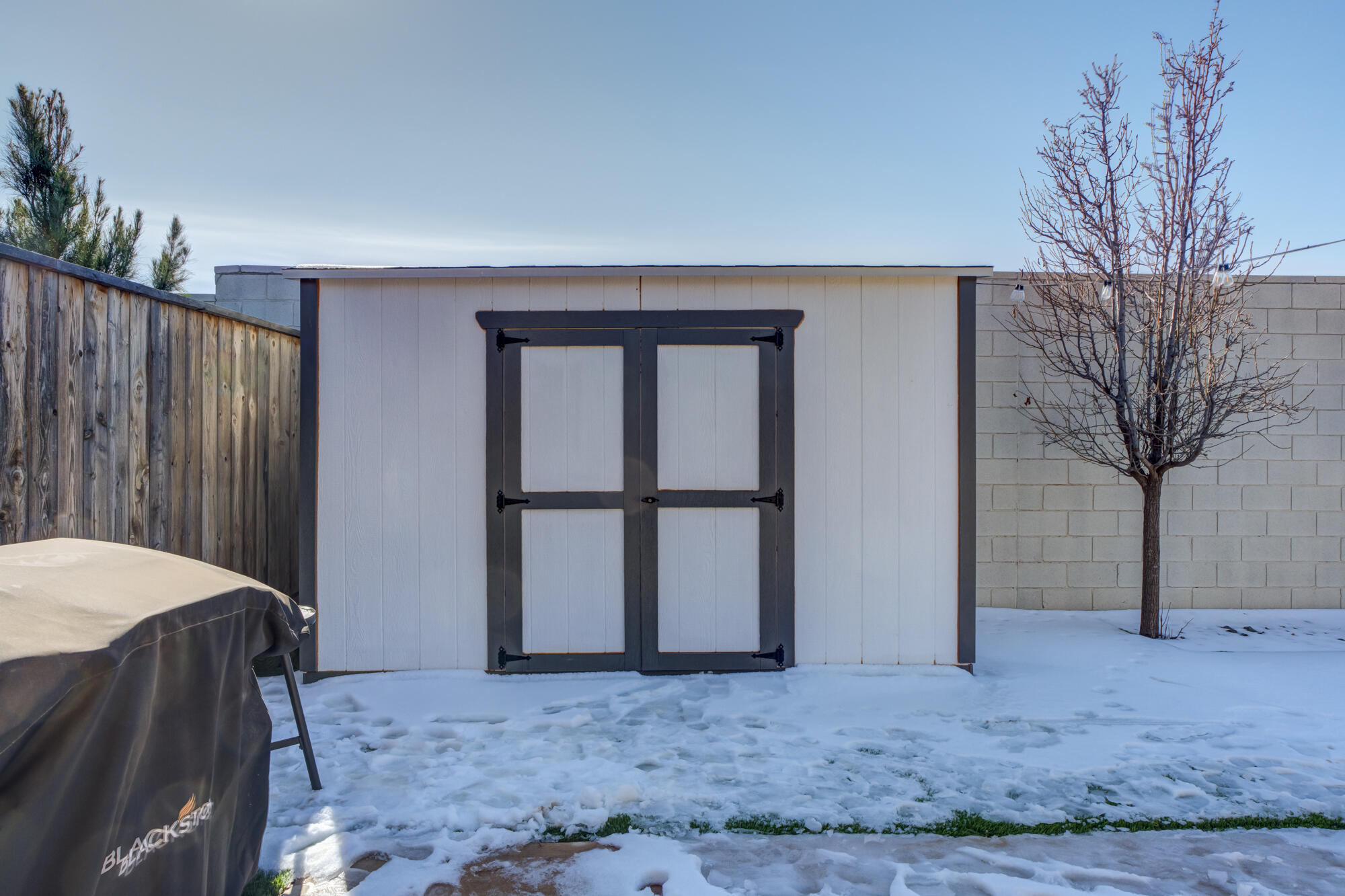 3627 128th Street Lubbock, TX 79423 - Photo 59 of 60 a view of a bedroom with a bed and a large window