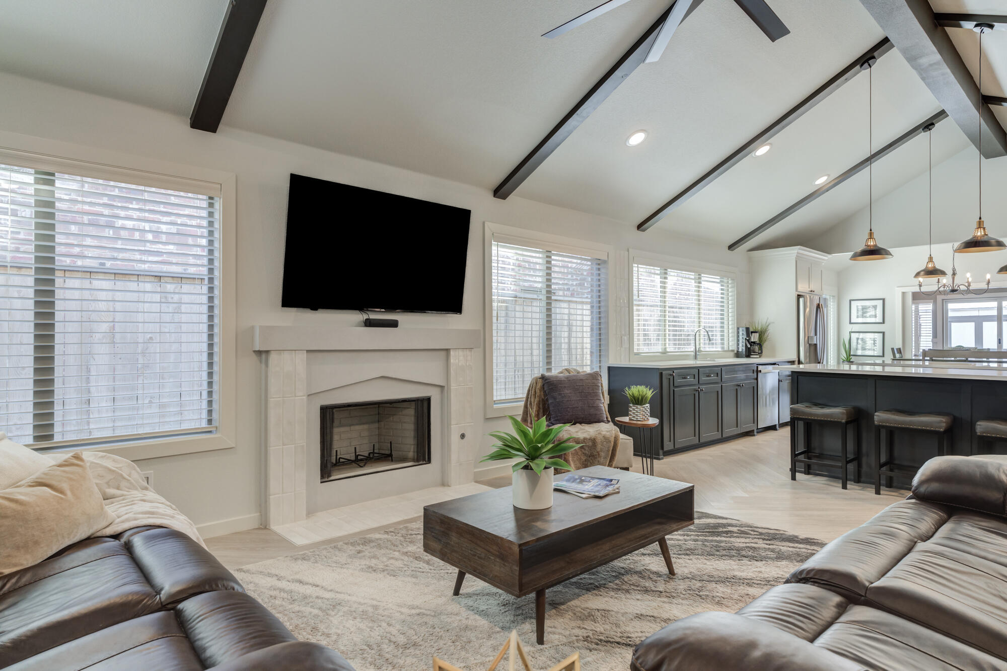 3627 128th Street Lubbock, TX 79423 - Photo 6 of 60 a living room with furniture a flat screen tv and a fireplace