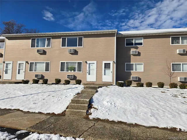 a view of a house with snow on the ground