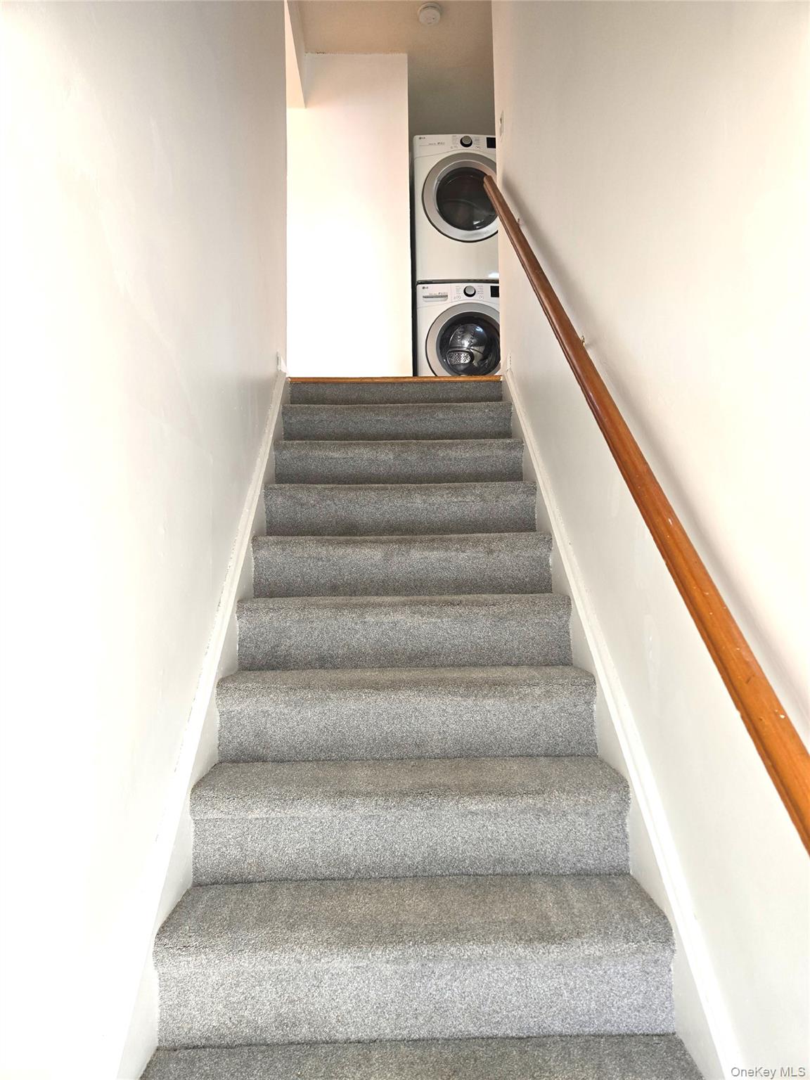 9 Fishkill Glen Drive, Unit F Fishkill, NY 12524 - Photo 2 of 10 Stairs featuring stacked washer / dryer