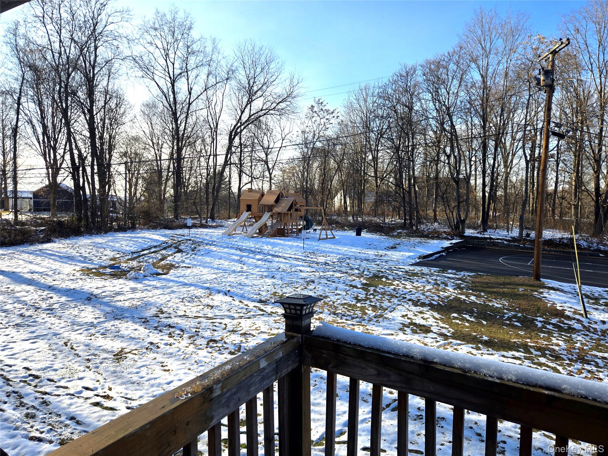 9 Fishkill Glen Drive, Unit F Fishkill, NY 12524 - Photo 10 of 10 View of yard featuring a playground and a wooden deck