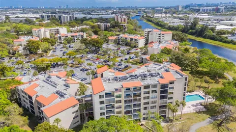 an aerial view of residential building with parking space