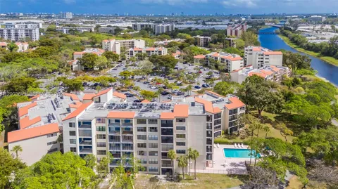 an aerial view of residential building with parking space