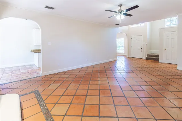 a view of an empty room and wooden floor