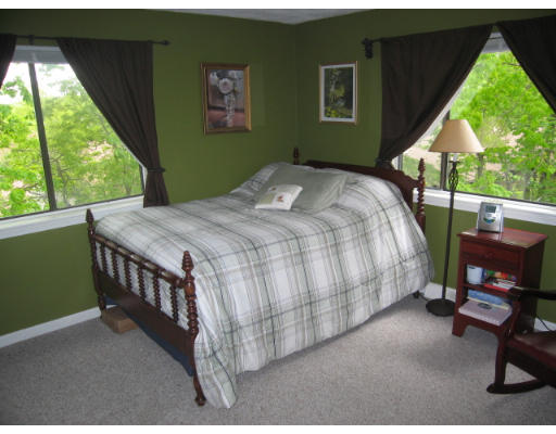 116 Mountain Gate Road, Unit 116 Ashland, MA 01721 - Photo 13 of 20 a bedroom with a bed and a window