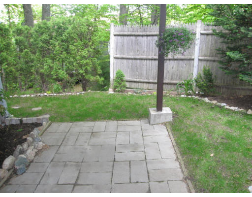 116 Mountain Gate Road, Unit 116 Ashland, MA 01721 - Photo 17 of 20 a view of a backyard with a garden