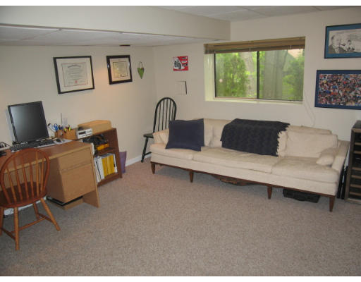 116 Mountain Gate Road, Unit 116 Ashland, MA 01721 - Photo 8 of 20 a living room with furniture and a flat screen tv