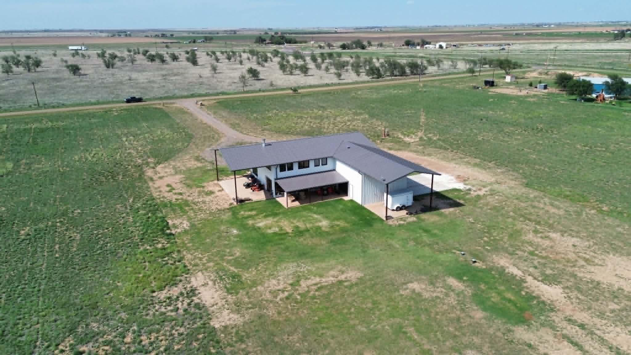 6792 Maine Road Anton, TX 79313 - Photo 77 of 77 aerial view of a house with a garden and lake view