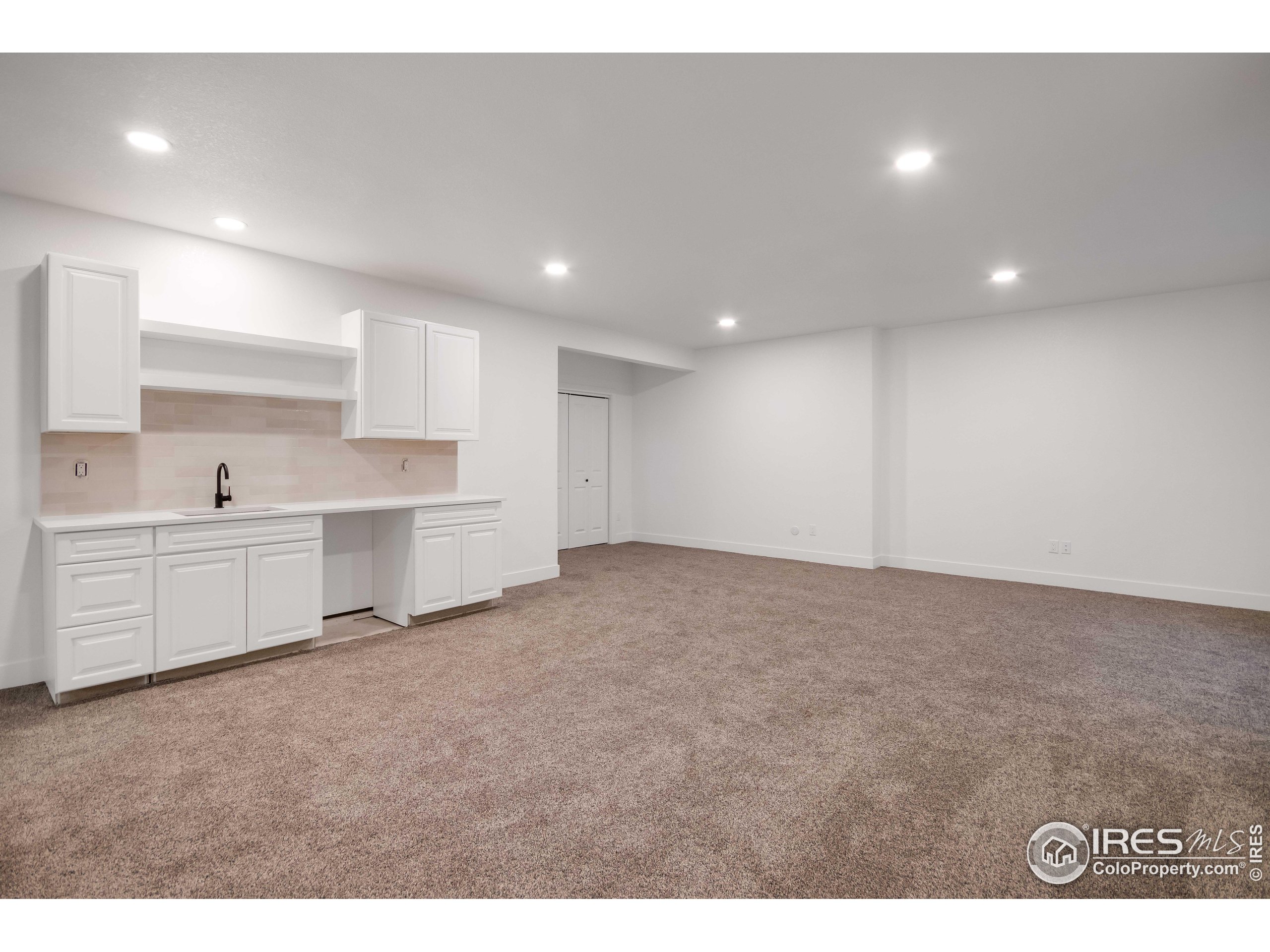 1230 Swainson Road Eaton, CO 80615 - Photo 30 of 35 a view of a kitchen with white cabinets