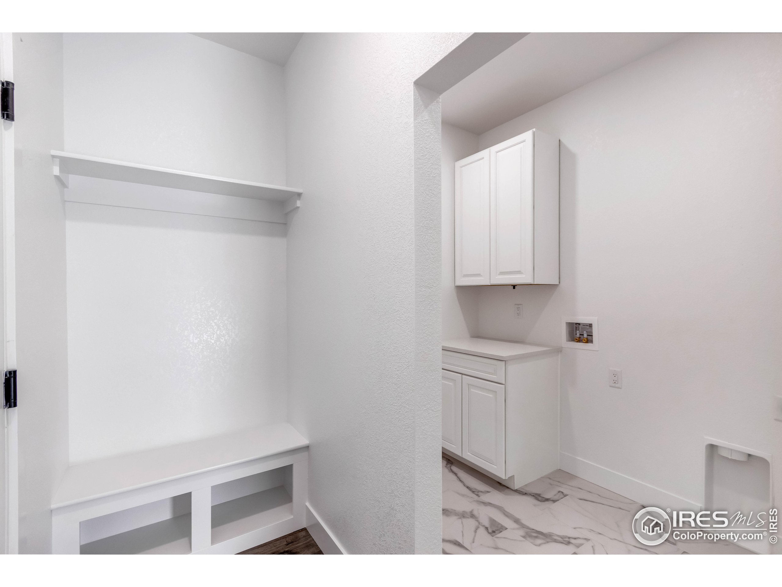 1230 Swainson Road Eaton, CO 80615 - Photo 3 of 35 a kitchen with white cabinets and sink