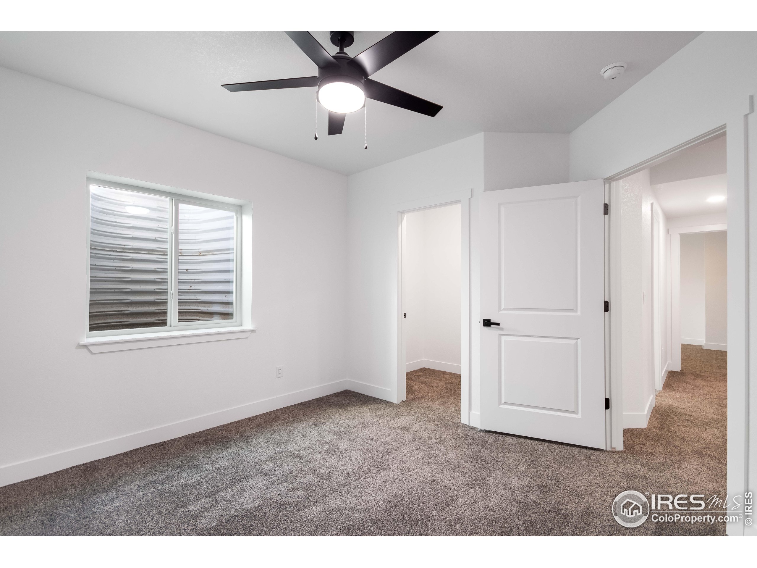1230 Swainson Road Eaton, CO 80615 - Photo 31 of 35 a view of an empty room with a window