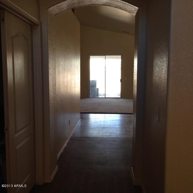 3228 West Maldonado Road Phoenix, AZ 85041 - Photo 5 of 6 a view of empty room with wooden floor