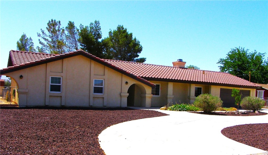 14475 Hopi Road Apple Valley, CA 92307 - Photo 1 of 1 a house view with a backyard space
