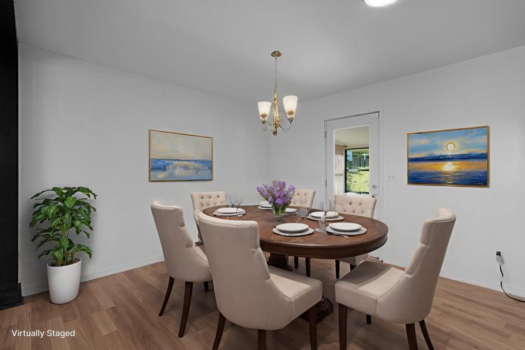 1717 East Rebel Road Rossville, GA 30741 - Photo 13 of 36 a view of a dining room with furniture and wooden floor