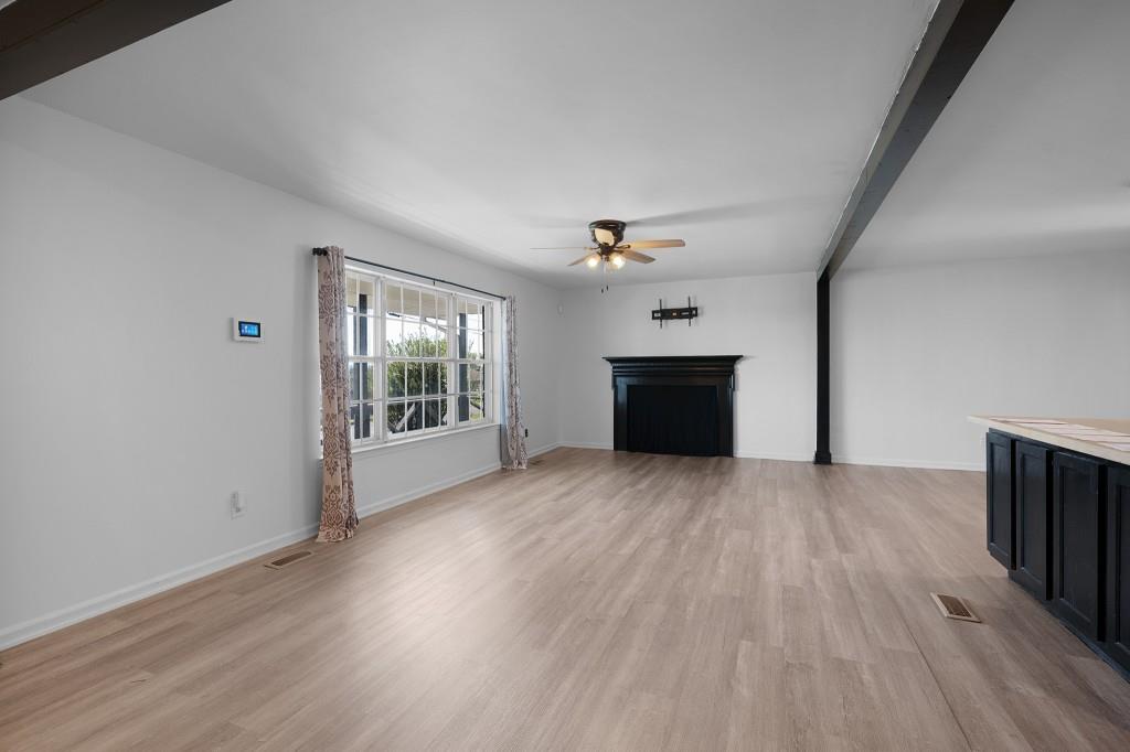 1717 East Rebel Road Rossville, GA 30741 - Photo 16 of 36 a view of empty room with wooden floor and fan